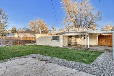 a house with a yard with a fence at Spacious home near Anschutz/DIA in Aurora
