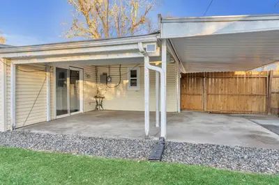 a house with a garage with a fence at Spacious home near Anschutz/DIA in Aurora
