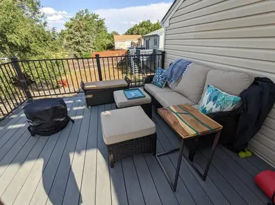 a patio with a couch and a table on a deck at 2B2B pet-friendly with views near dog park in Westminster