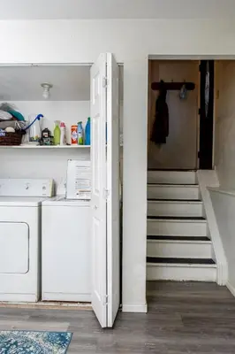 a stairway leading up to a kitchen with white stairs at 2B2B pet-friendly with views near dog park in Westminster