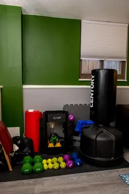 a room with a green wall and a table with a coffee maker at 2B2B pet-friendly with views near dog park in Westminster