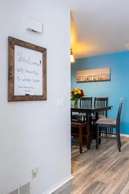 a dining room with a table and a picture on the wall at 2B2B pet-friendly with views near dog park in Westminster