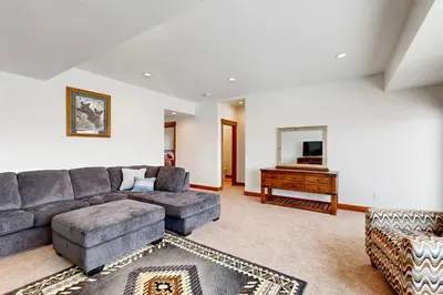 a living room with a couch and a table at Lone Eagle in Granby