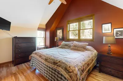a bedroom with a large bed and a window at Antlers Gulch Townhomes #71 in Keystone