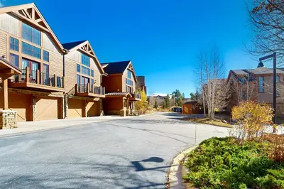 an empty street in a small town with houses at Antlers Gulch Townhomes #71 in Keystone