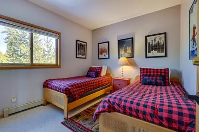 a bedroom with two beds and a window at Heated Pool Access and Near Skiing Colorado Retreat in Silverthorne