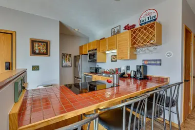 a kitchen with a counter top in a room at Heated Pool Access and Near Skiing Colorado Retreat in Silverthorne