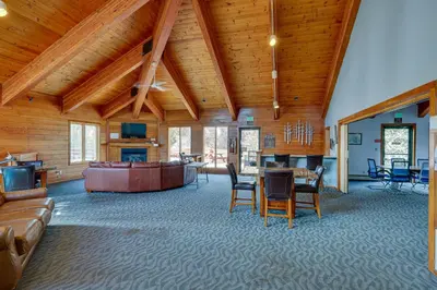 a large living room with a table and chairs at Heated Pool Access and Near Skiing Colorado Retreat in Silverthorne