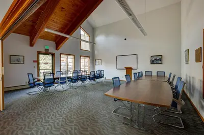 a conference room with a long table and chairs at Heated Pool Access and Near Skiing Colorado Retreat in Silverthorne