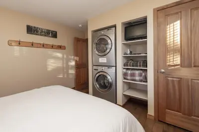 a laundry room with a washer and dryer at Hi Country Haus - 10-18,,, condo in Winter Park