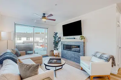 a living room with a couch and a fireplace at Mellow on Meadow Mile 2A in Fraser