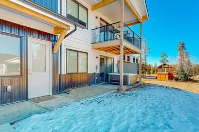 a house with a balcony and a staircase at Mellow on Meadow Mile 2A in Fraser
