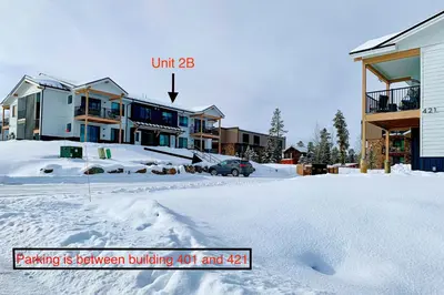 a parking lot covered in snow next to houses at Mellow on Meadow Mile 2B in Fraser