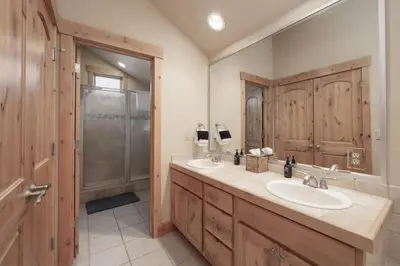 a bathroom with two sinks and a shower at Antler Way at Lakota,,,, townhouse in Winter Park