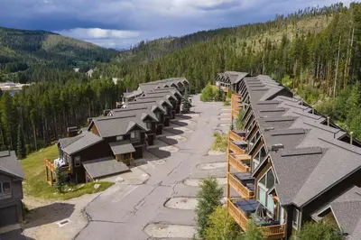 an aerial view of a row of houses in the mountains at Antler Way at Lakota,,,, townhouse in Winter Park