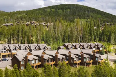 an aerial view of a resort building with trees at Antler Way at Lakota,,,, townhouse in Winter Park