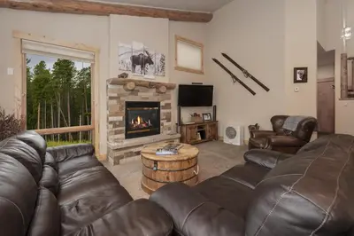 a living room with a couch and a fireplace at Antler Way at Lakota,,,, townhouse in Winter Park