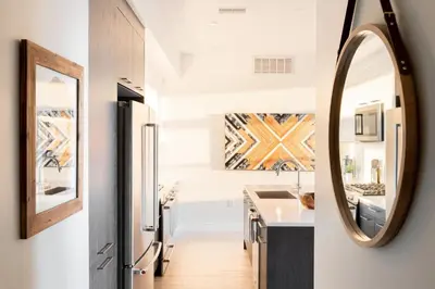 a kitchen with a sink and a mirror at Bold & Elevated | Espadin LoHi in Denver