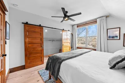 a bedroom with a bed and a ceiling fan at Race St - Denver in Denver