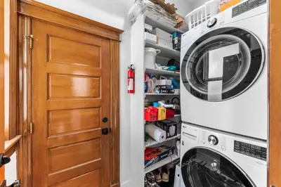 a laundry room with a washer and dryer at Race St - Denver in Denver