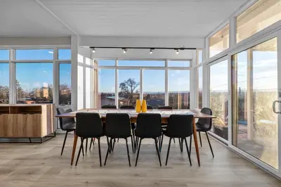 a dining room with a large table and chairs at Lunceford - Northglenn in Northglenn