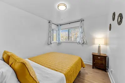 a bedroom with a bed and a window at Carr - Lakewood in Lakewood