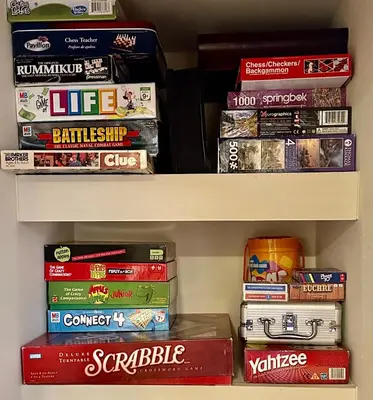 a book shelf filled with lots of board games at Keystone Lakeside Condo in Keystone
