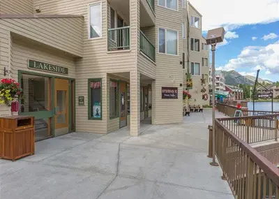 a building with a sign on the side of it at Keystone Lakeside Condo in Keystone