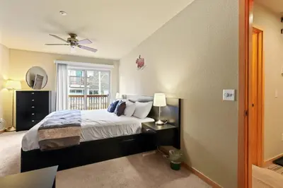 a bedroom with a bed and a ceiling fan at 2BR Condo - Ideal Hub for Year-Round Fun in Silverthorne