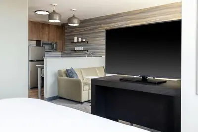 a living room with a flat screen tv on a table at Residence Inn by Marriott Arvada Denver West in Arvada