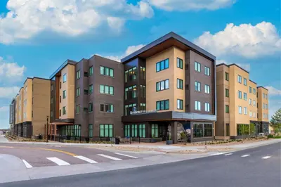a building on the side of a street at Residence Inn by Marriott Arvada Denver West in Arvada