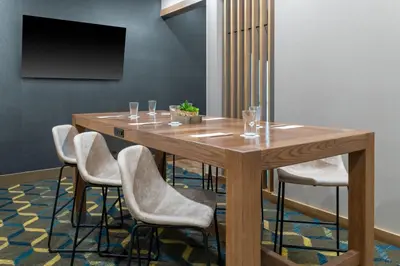 a conference room with a wooden table and chairs at Residence Inn by Marriott Arvada Denver West in Arvada