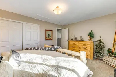 a bedroom with two beds and a dresser at Loveland Home with Private Hot Tub and Wood Fireplace! in Loveland