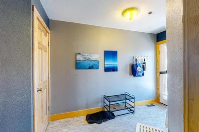 a hallway with a table on a wall at La Rive Del Lago 302 in Dillon