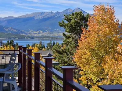 a balcony with a view of a lake and mountains at La Rive Del Lago 302 in Dillon
