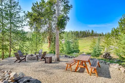 a patio with a picnic table and chairs at 4 Mi to Rocky Mtn Natl Park Cabin Near Town! in Grand Lake