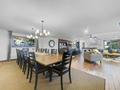 a dining room and living room with a table and chairs at 208 Tenderfoot 5Br 5Ba home in Dillon