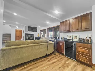 a living room with a couch and a kitchen at 208 Tenderfoot 5Br 5Ba home in Dillon