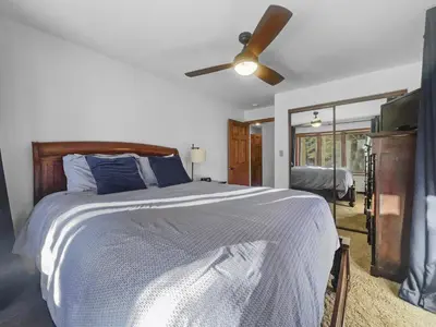 a bedroom with a bed and a ceiling fan at 208 Tenderfoot 5Br 5Ba home in Dillon