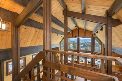 an overhead view of a timber frame cabin with wooden ceilings and windows at 273 Fallen Rock in Tabernash