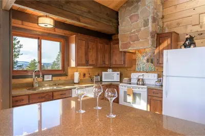 a kitchen with two wine glasses on a counter at 273 Fallen Rock in Tabernash