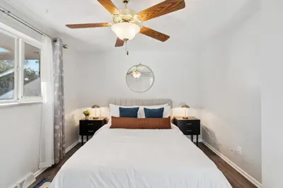 a bedroom with a bed and a ceiling fan at NEW • Modern • 4BR • Game Rm • Ping-Pong in Arvada