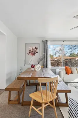 a living room with a table and a couch at NEW • Modern • 4BR • Game Rm • Ping-Pong in Arvada