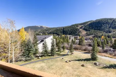 a view from the balcony of a house in the mountains at 2656 Tenderfoot Lodge condo in Keystone