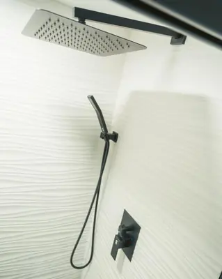 a lamp hanging from the wall of a room at Windsor Retreat Private Basement Suite in Denver