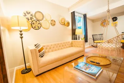 a living room with a couch and a table at Windsor Retreat Private Basement Suite in Denver