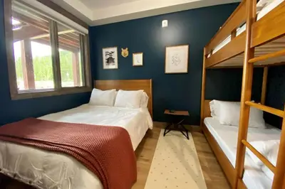 two beds in a room with two bunk beds at Seasons 1889 - Keystone in Keystone
