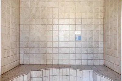 a tiled bathroom with a bath tub in a room at Seasons 1889 - Keystone in Keystone