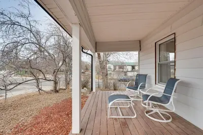 two chairs and a table on a porch at Chic Erie Vacation Rental about 14 Mi to Boulder! in Erie