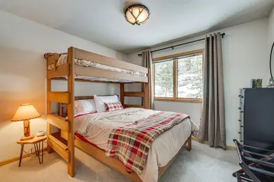 a bedroom with a bunk bed and a window at Less Than half Mi to Marina Grand Lake Getaway! in Grand Lake